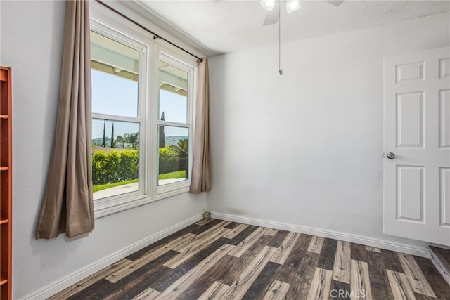 240 E 52nd St, San Bernardino, CA 92404 - empty room featuring dark wood finished floors, a ceiling fan, and baseboards