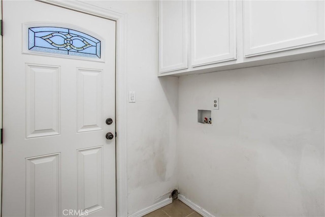 240 E 52nd St, San Bernardino, CA 92404 - laundry room featuring hookup for a washing machine, cabinet space, baseboards, and tile patterned flooring