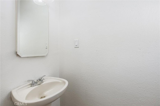 240 E 52nd St, San Bernardino, CA 92404 - bathroom featuring a sink
