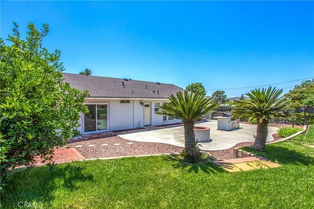 240 E 52nd St, San Bernardino, CA 92404 - back of house with a patio area and a lawn