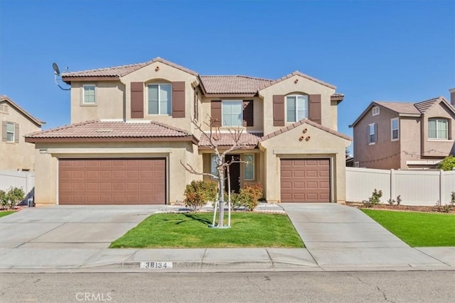 38134 E Clermont, Palmdale, CA 93552 - mediterranean / spanish house with concrete driveway, a tile roof, and stucco siding