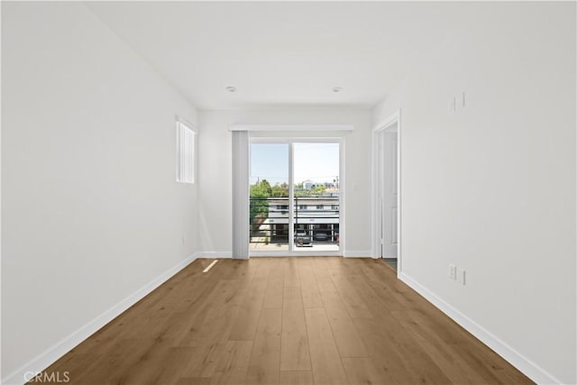 5218 Auckland Ave, Toluca Lake, CA 91601 - unfurnished room featuring baseboards and wood finished floors