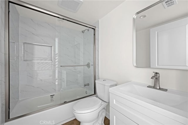 5218 Auckland Ave, Toluca Lake, CA 91601 - bathroom with toilet, shower / bath combination with glass door, and vanity