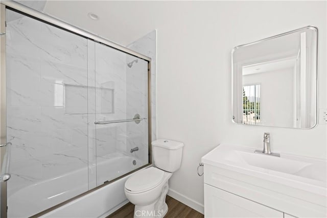 5218 Auckland Ave, Toluca Lake, CA 91601 - full bath with wood finished floors, toilet, vanity, baseboards, and enclosed tub / shower combo