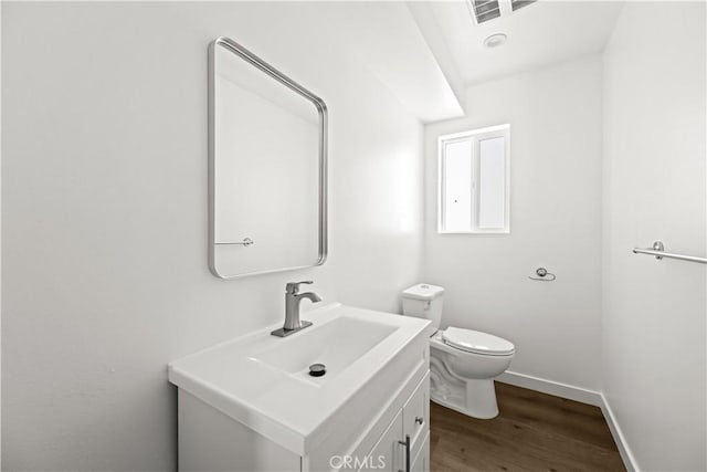 5218 Auckland Ave, Toluca Lake, CA 91601 - bathroom featuring wood finished floors, vanity, toilet, and baseboards