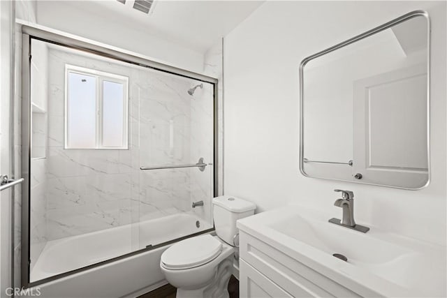 5218 Auckland Ave, Toluca Lake, CA 91601 - bathroom featuring toilet, combined bath / shower with glass door, and vanity
