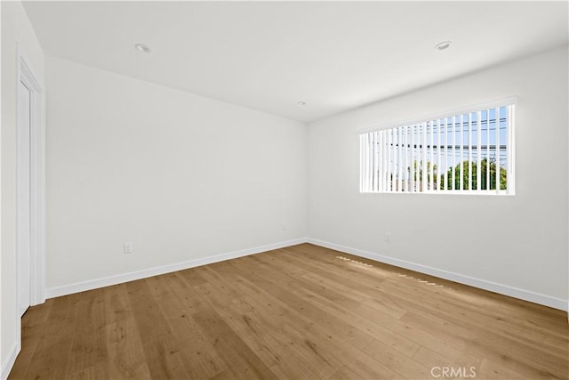 5218 Auckland Ave, Toluca Lake, CA 91601 - unfurnished room with wood finished floors and baseboards