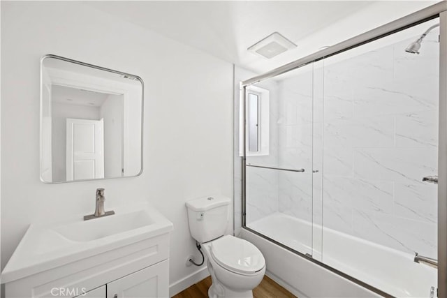 5218 Auckland Ave, Toluca Lake, CA 91601 - bathroom with toilet, vanity, shower / bath combination with glass door, and wood finished floors