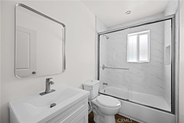 5218 Auckland Ave, Toluca Lake, CA 91601 - bathroom featuring bath / shower combo with glass door, toilet, and vanity