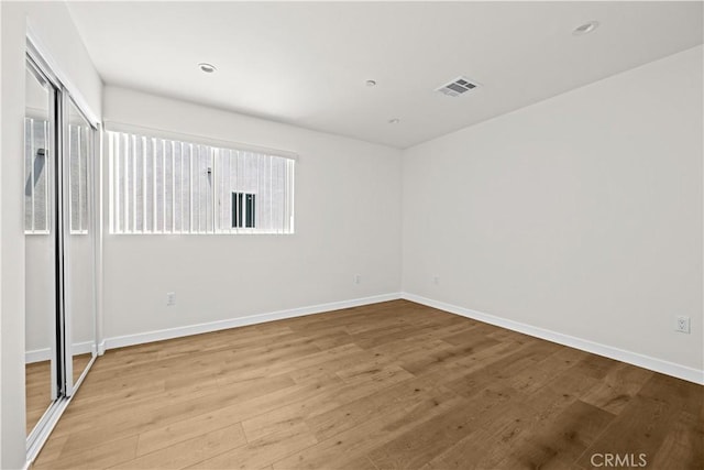 5218 Auckland Ave, Toluca Lake, CA 91601 - spare room featuring wood finished floors, plenty of natural light, and baseboards