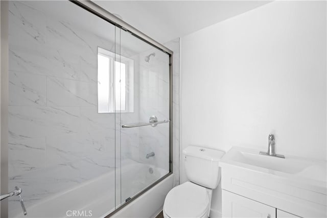 5218 Auckland Ave, Toluca Lake, CA 91601 - bathroom with bath / shower combo with glass door, toilet, and vanity