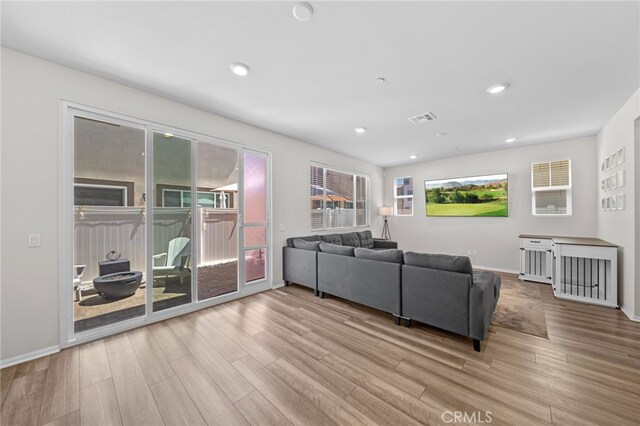 40620 Melrose Dr, Temecula, CA 92591 - living room featuring wood finished floors, baseboards, and recessed lighting