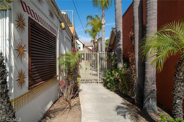 1631 E 4th St, Long Beach, CA 90802 - view of side of home featuring a gate and stucco siding