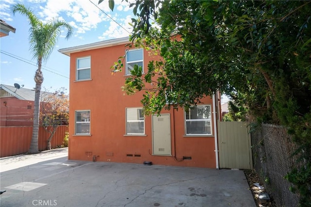 1631 E 4th St, Long Beach, CA 90802 - back of property featuring stucco siding and a patio area