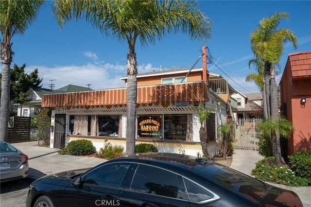1631 E 4th St, Long Beach, CA 90802 - view of front facade featuring a balcony and a gate