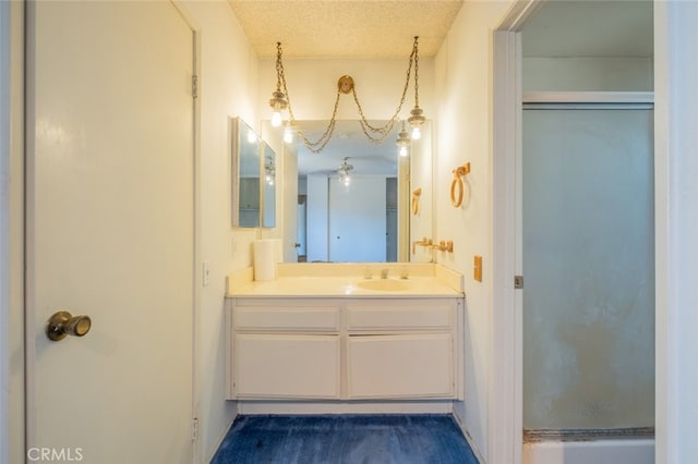 170 E Payson St, Azusa, CA 91702 - full bath with a shower with shower door, vanity, and a textured ceiling
