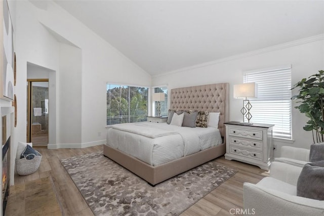 24882 Summerwind, Dana Point, CA 92629 - bedroom with high vaulted ceiling, light wood-style floors, baseboards, and ornamental molding