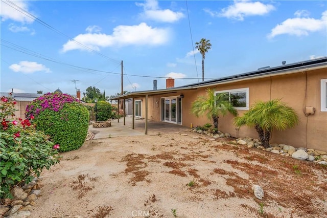 8535 La Vine St, Rancho Cucamonga, CA 91701 - rear view of house with a patio, stucco siding, and a chimney