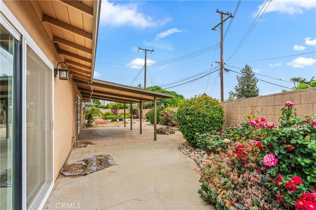 8535 La Vine St, Rancho Cucamonga, CA 91701 - fenced backyard with a patio and a carport