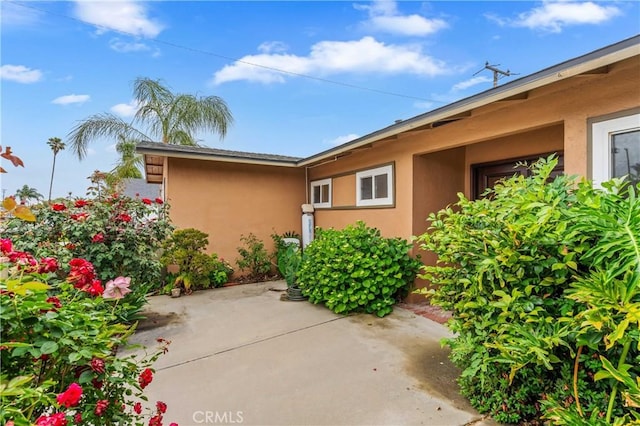 8535 La Vine St, Rancho Cucamonga, CA 91701 - view of side of home with stucco siding and a patio
