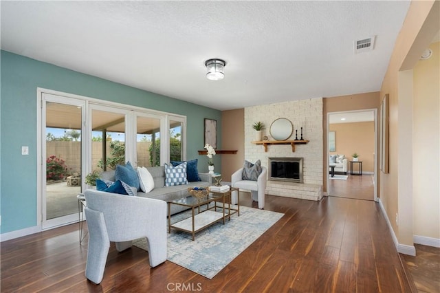 8535 La Vine St, Rancho Cucamonga, CA 91701 - living room with dark wood-type flooring, a brick fireplace, and baseboards