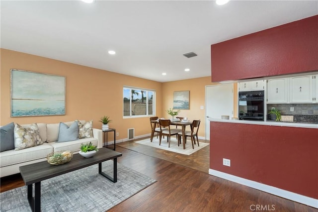 8535 La Vine St, Rancho Cucamonga, CA 91701 - living room featuring recessed lighting, dark wood-style floors, and baseboards
