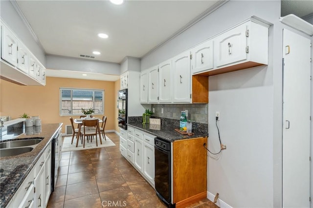 8535 La Vine St, Rancho Cucamonga, CA 91701 - kitchen featuring a sink, white cabinets, a warming drawer, decorative backsplash, and recessed lighting