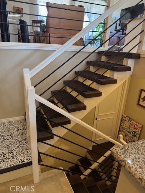 2400 Altisma Way Unit B, Carlsbad, CA 92009 - stairs with baseboards and tile patterned floors