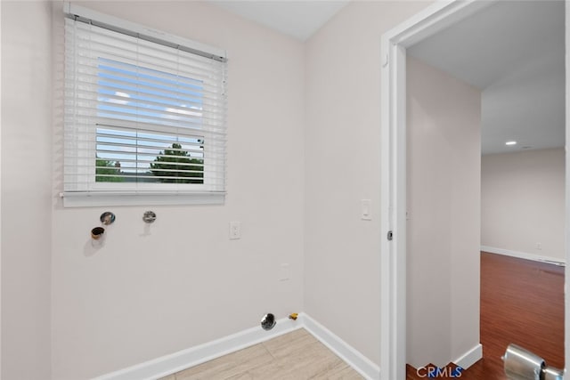 17148 Stare St, Northridge, CA 91325 - laundry room featuring baseboards, wood finished floors, and washer hookup