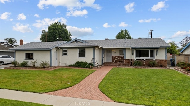 17148 Stare St, Northridge, CA 91325 - ranch-style home featuring a front lawn, stucco siding, a gate, and brick siding