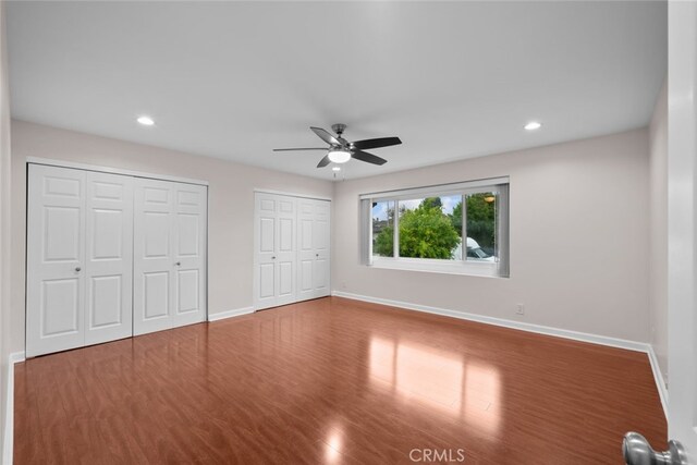 17148 Stare St, Northridge, CA 91325 - unfurnished bedroom featuring multiple closets, baseboards, wood finished floors, and recessed lighting