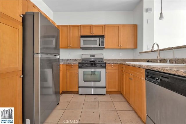 100 S Alameda St Unit 162, Los Angeles, CA 90012 - kitchen with stainless steel appliances, a sink, light tile patterned flooring, and light stone counters