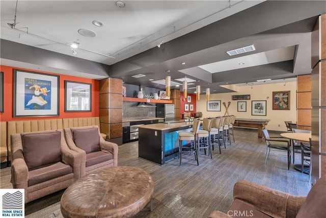 100 S Alameda St Unit 162, Los Angeles, CA 90012 - indoor wet bar featuring freestanding refrigerator and dark wood-style flooring