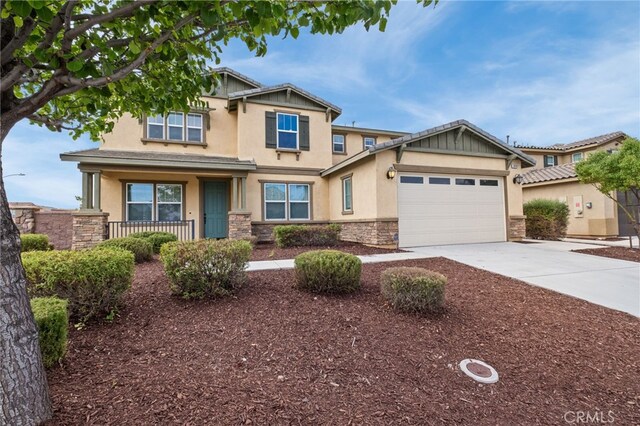 30183 Redding Ave, Murrieta, CA 92563 - craftsman inspired home with stone siding, stucco siding, driveway, a porch, and a garage