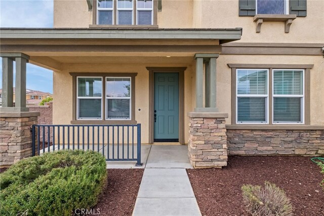 30183 Redding Ave, Murrieta, CA 92563 - entrance to property with covered porch, stone siding, and stucco siding