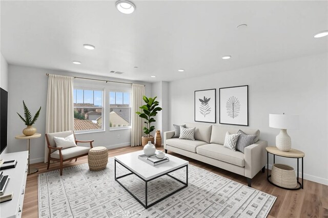 30183 Redding Ave, Murrieta, CA 92563 - living area with light wood finished floors, baseboards, and recessed lighting