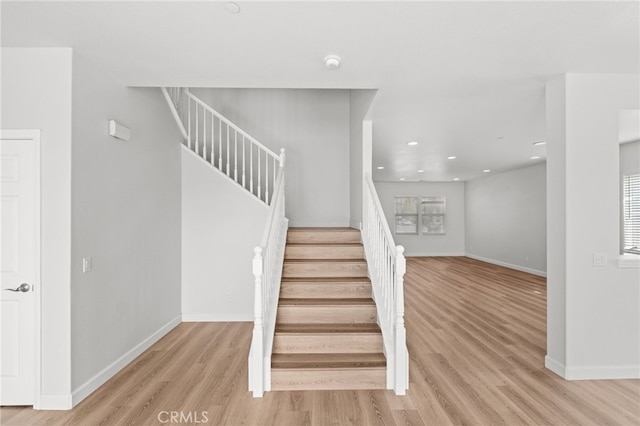 30183 Redding Ave, Murrieta, CA 92563 - stairs featuring wood finished floors, recessed lighting, and baseboards