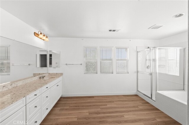 30183 Redding Ave, Murrieta, CA 92563 - bathroom with vanity, wood finished floors, a stall shower, and baseboards