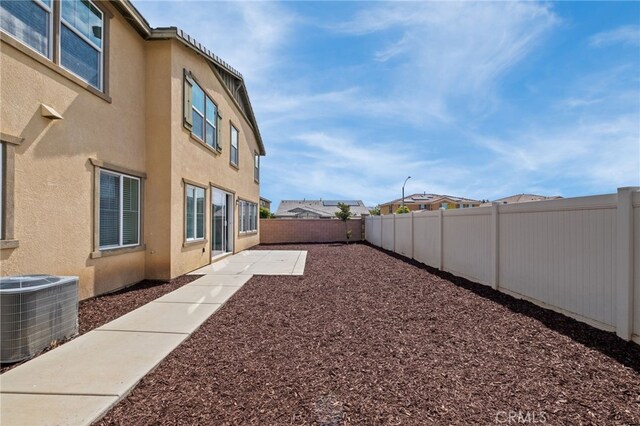 30183 Redding Ave, Murrieta, CA 92563 - fenced backyard featuring central AC and a patio