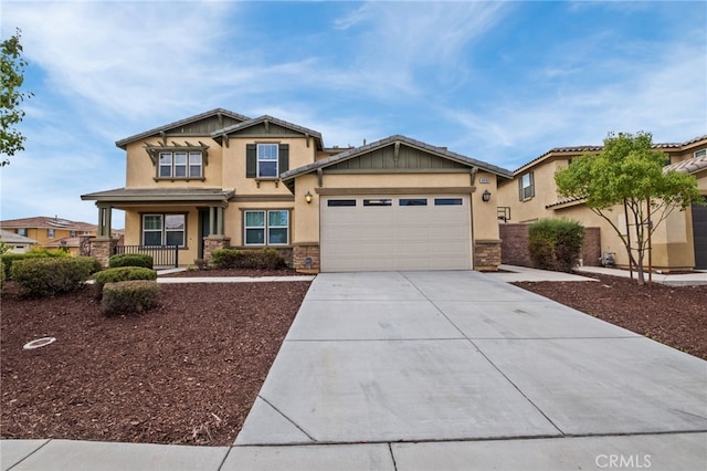 30183 Redding Ave, Murrieta, CA 92563 - craftsman house with driveway, an attached garage, stone siding, and a porch