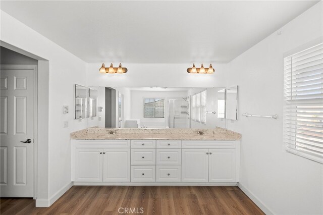 30183 Redding Ave, Murrieta, CA 92563 - bathroom with wood finished floors, a shower stall, baseboards, and double vanity