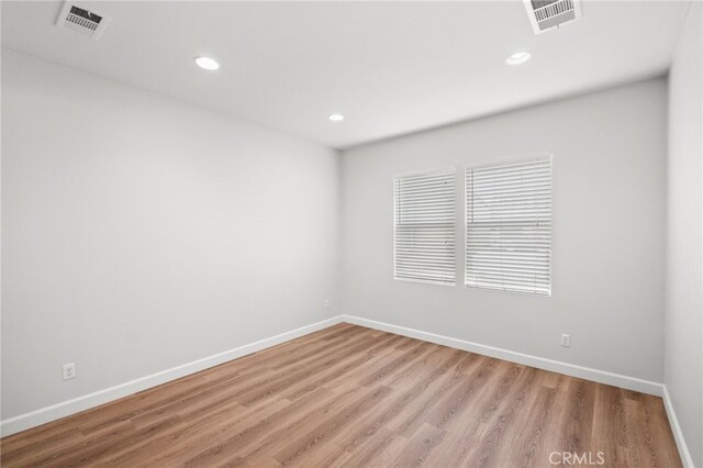 30183 Redding Ave, Murrieta, CA 92563 - empty room featuring light wood finished floors, baseboards, and recessed lighting