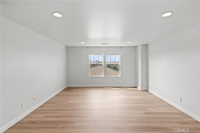 30183 Redding Ave, Murrieta, CA 92563 - spare room with recessed lighting, light wood-type flooring, and baseboards