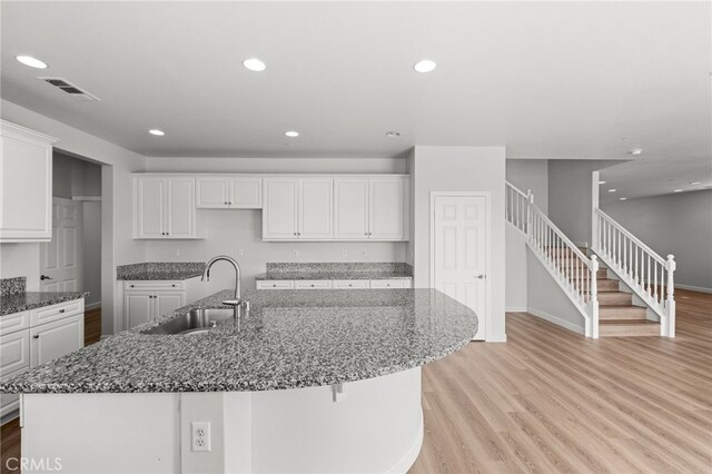 30183 Redding Ave, Murrieta, CA 92563 - kitchen featuring a sink, light wood-style flooring, white cabinetry, baseboards, and recessed lighting