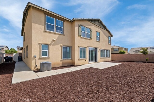 30183 Redding Ave, Murrieta, CA 92563 - back of house featuring central AC unit, a fenced backyard, stucco siding, and a patio area