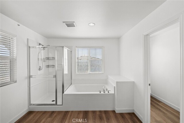 30183 Redding Ave, Murrieta, CA 92563 - full bathroom featuring a shower stall, a garden tub, and wood finished floors
