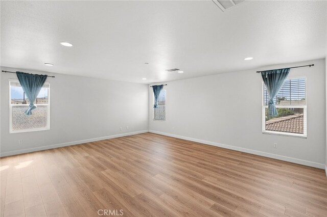 30183 Redding Ave, Murrieta, CA 92563 - empty room featuring light wood-style flooring, plenty of natural light, recessed lighting, and baseboards