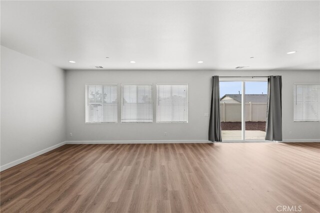 30183 Redding Ave, Murrieta, CA 92563 - empty room featuring light wood-style flooring, baseboards, and recessed lighting