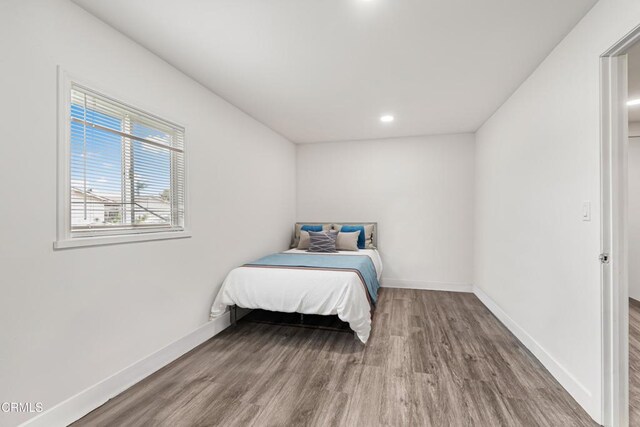 124 N Driskill St, Oxnard, CA 93030 - bedroom with wood finished floors, baseboards, and recessed lighting