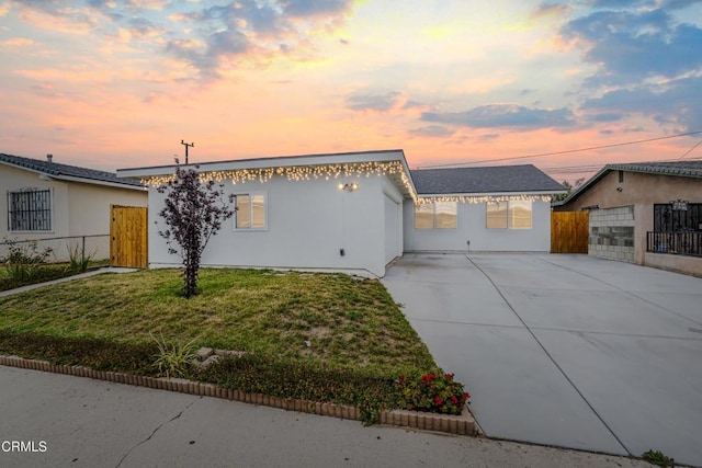 124 N Driskill St, Oxnard, CA 93030 - view of front of home featuring driveway and stucco siding